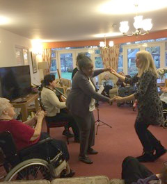 Orchestra of the Swan bassoonist Maria Mealey enjoying an impromptu dance session during a session at Barchester Edgbaston Beaumont, December 2016